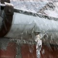 How do you seal a downspout hole?