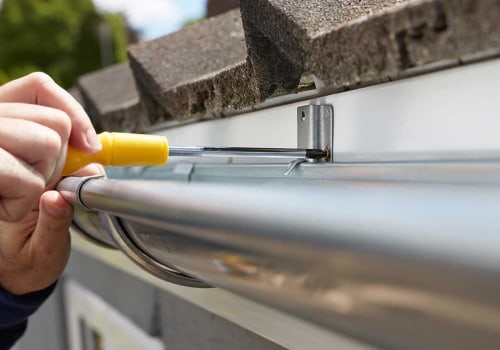 How far should gutters extend past the fascia?